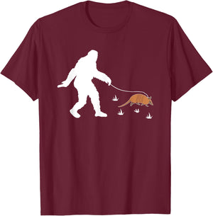 Funny Bigfoot Walking An Armadillo T-Shirt - T-Shirt | Maroon