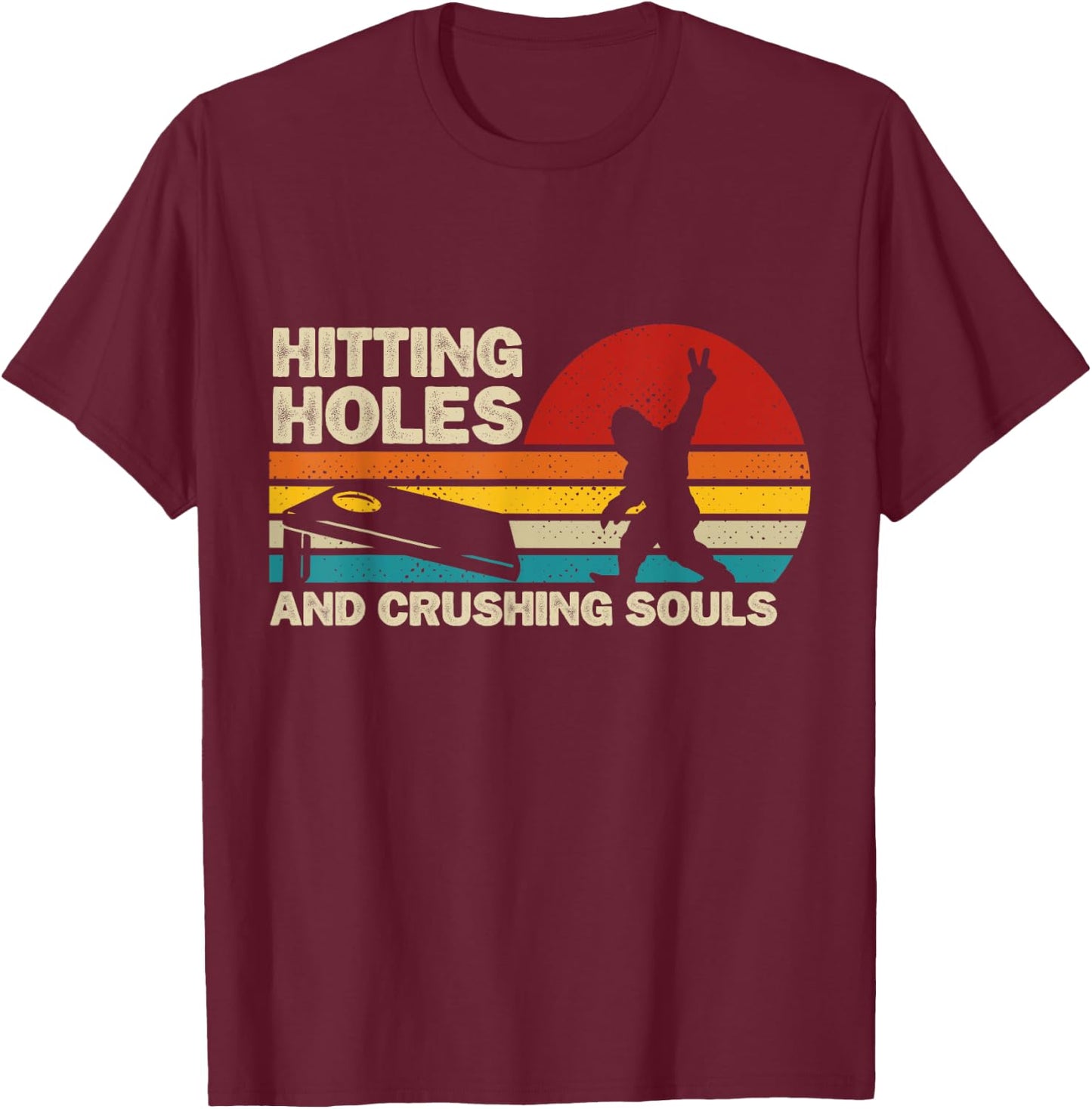 Hitting Holes And Crushing Souls Funny Bigfoot Cornhole T-Shirt - T-Shirt | Maroon