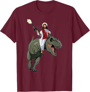Gun Jesus Riding A T-rex Dinosaur Funny Christian Dino Lover T-Shirt - T-Shirt | Maroon