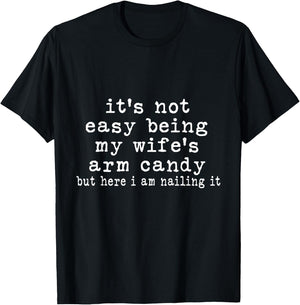 It's Not Easy Being My Wife's Arm Candy But Here I Am Nailin T-Shirt - T-Shirt | Black