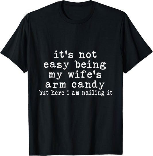It's Not Easy Being My Wife's Arm Candy But Here I Am Nailin T-Shirt - T-Shirt | Black