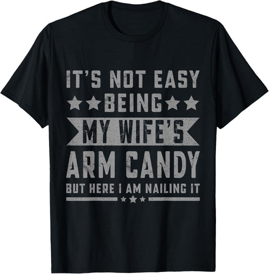 Its Not Easy Being My Wife's Arm Candy But Here I Am Nailing T-Shirt - T-Shirt | Black